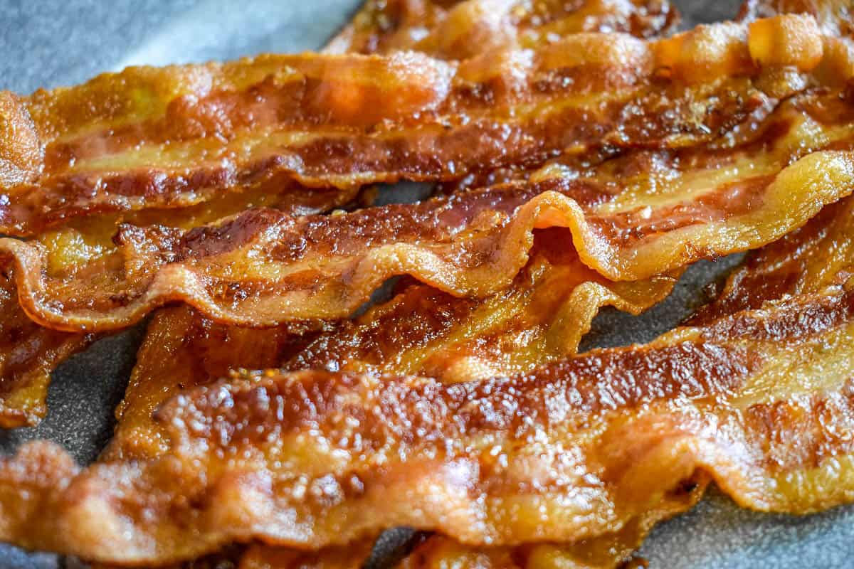 A close up image of crispy bacon strips.