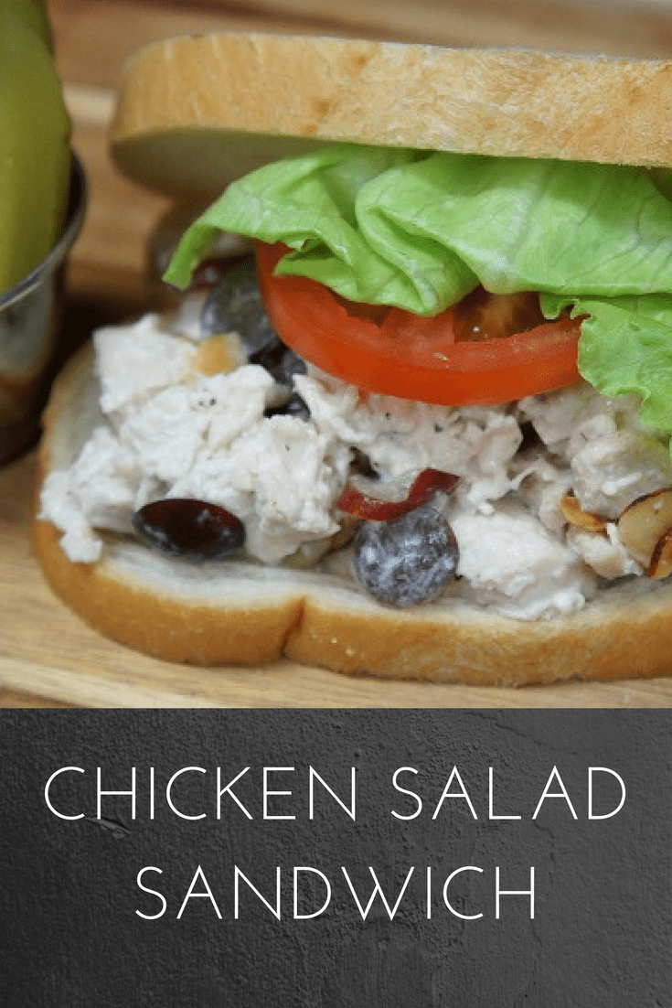 A light lunch is perfect on a hot day, and this chicken salad sandwich is just the thing. Poached chicken breast, toasted almonds and sliced grapes are combined with a slightly sweet dressing to create the perfect chicken salad. Serve the chicken salad on your favorite bread, with a bowl of soup or, eliminate the bread altogether and add a heaping scoop on a bed of lettuce. #chickensaladsandwich #chickensalad #chicken #lunch #lunches