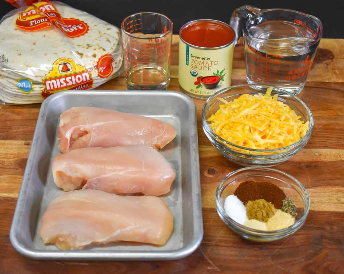 The prepped ingredients for the dish arranged on a wood cutting board.