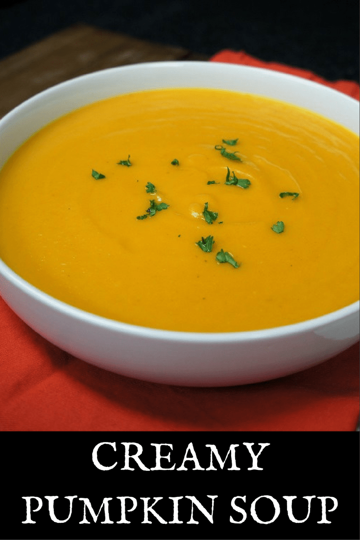 This Creamy Pumpkin Soup is loaded with good-for-you veggies and spices, with just a little bit of bacon and cream to keep things fun. It’s really easy to make, and doesn’t take too long. It’s a perfect starter soup, or serve it with a big piece of crusty bread for a light dinner. #creamypumpkinsoup #pumpkinsoup