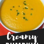 An image of the dish with a graphic that reads creamy pumpkin soup in white letters over black, used for pinterest.
