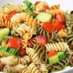 Garden Pasta Salad colorful rotini pasta with diced tomatoes and cucumbers served in a large white bowl