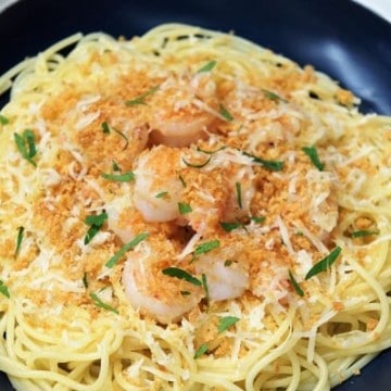 Garlic Parmesan Shrimp, a bed of thin spaghetti topped with shrimp, Parmesan cheese and crunch breadcrumbs