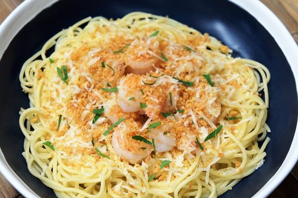 Garlic Parmesan Shrimp, a bed of thin spaghetti topped with shrimp, Parmesan cheese and crunch breadcrumbs