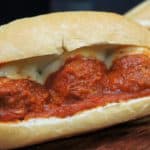 Italian Sausage Meatball Subs three saucy Italian sausage meatballs on a hoagie bun with melted mozzarella cheese