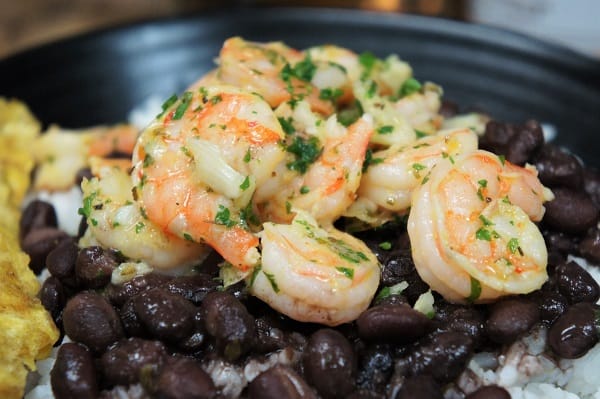 Mojo Shrimp with lots of garlic and parsley, served on white rice and black beans