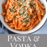 An image of the pasta with vodka sauce served in a white bowl with a black rim and a gray linen with a graphic in light gray with the title in white letters underneath.
