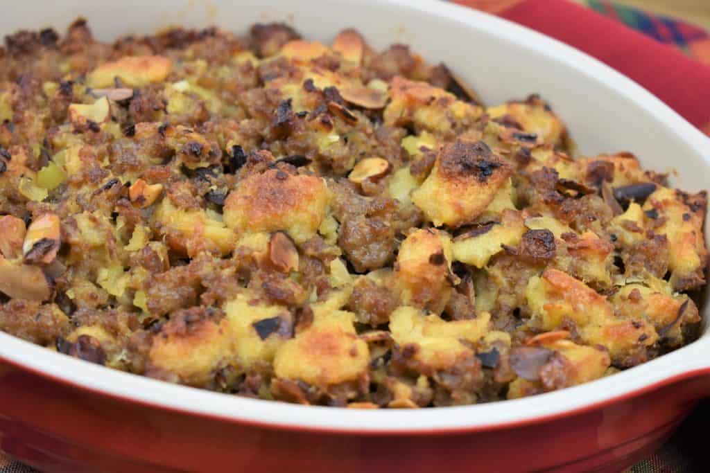Sausage Stuffing served in a red casserole dish