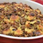 Sausage Stuffing served in a red casserole dish