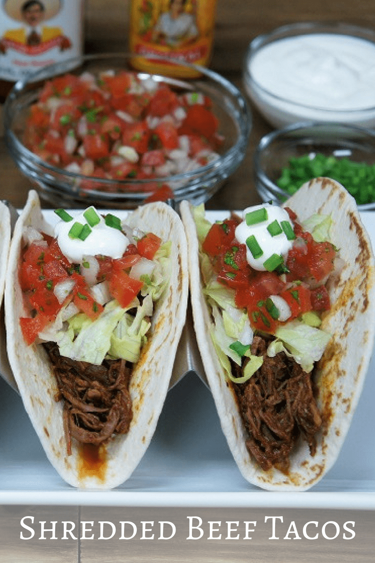 Shredded beef tacos are an easy and delicious way to shake up taco night. Flank steak is cooked in beef broth until tender and shredded. Then it’s added to a simple tomato sauce that flavored with a homemade taco seasoning mix. #shreddedbeeftacos #shreddedbeef #tacos #beeftacos #mexicanfood #southwestern #easydinners #beef