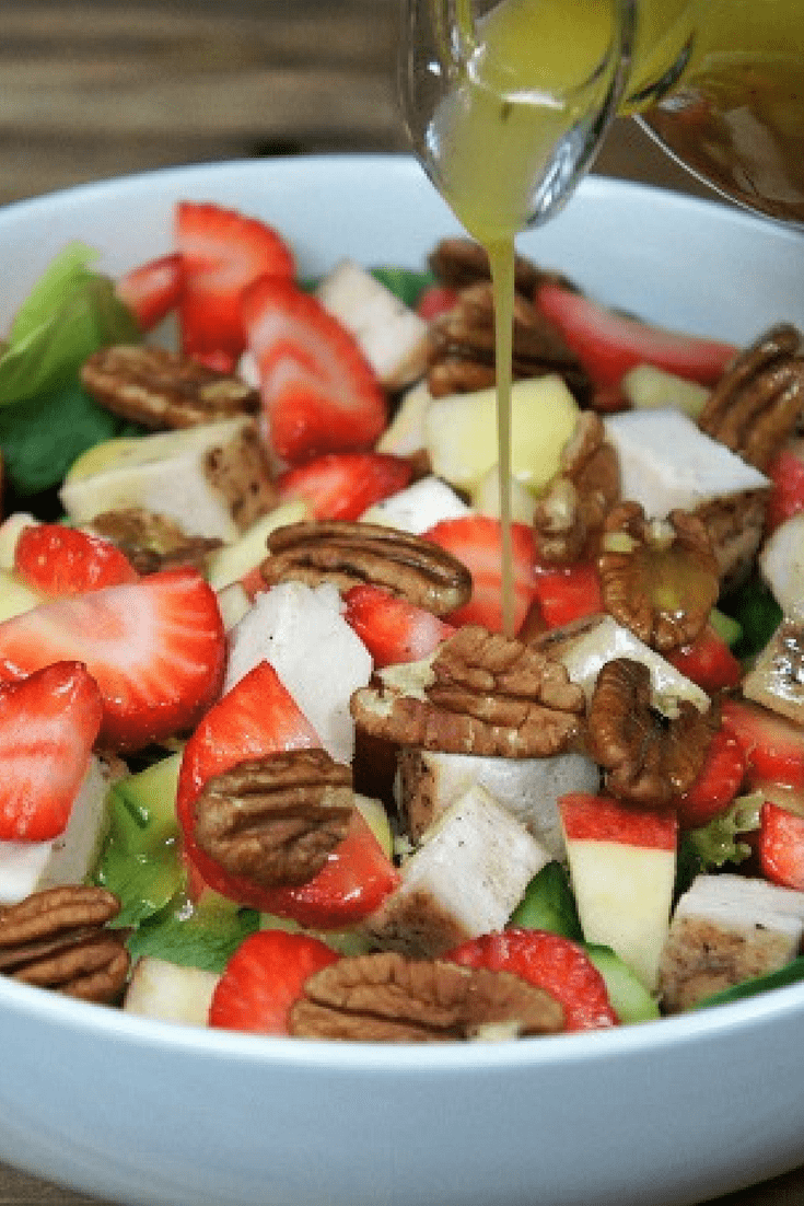 Spring chicken salad, grilled chicken, strawberries, apples, cucumbers and pecans on a bed of crisp lettuce. Served with a homemade apple cider vinaigrette. #springchickensalad #salad #chickensalad #applecidervinaigrette #homemadedressing #grilledchicken