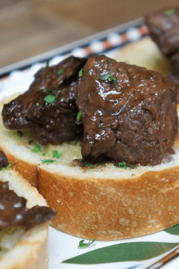 We serve these flavorful steak tidbits on garlic toast. The steak is marinated in a combination of soy sauce, Worcestershire sauce, garlic and spices. The tidbits are served bread that is lightly brushed with garlic infused oil. #steaktidbits #garlictoast #appetizers #steakappetizers #partyfood #steak