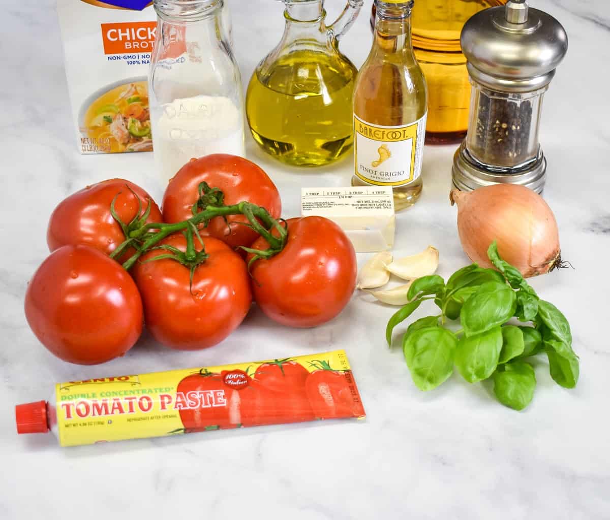 The ingredients before they are prepped arranged on a white table.