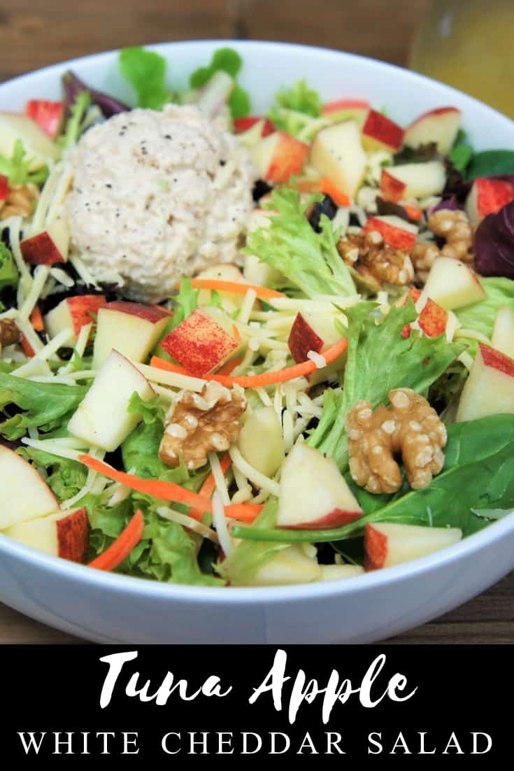 Forget boring salads, this tuna apple white cheddar salad is loaded with delicious and filling ingredients. This salad starts with a bed of lettuce, then we add a light, yet creamy tuna salad. For some crunch, there's walnuts and shredded carrots. White cheddar cheese adds even more flavor and a creamy touch. Top it all off with a homemade apple cider vinaigrette and you’ll have a salad you will look forward to eating. #tunasalad #salad #tuna #lunch #lentrecipes #lent