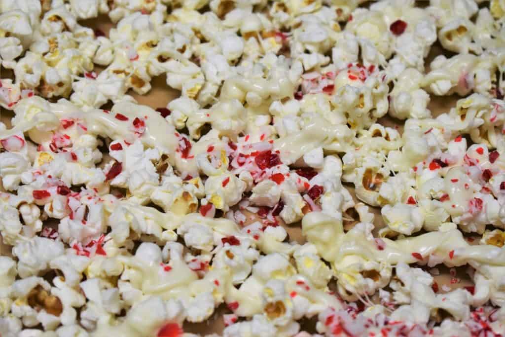 White Chocolate Peppermint Popcorn on a baking sheet