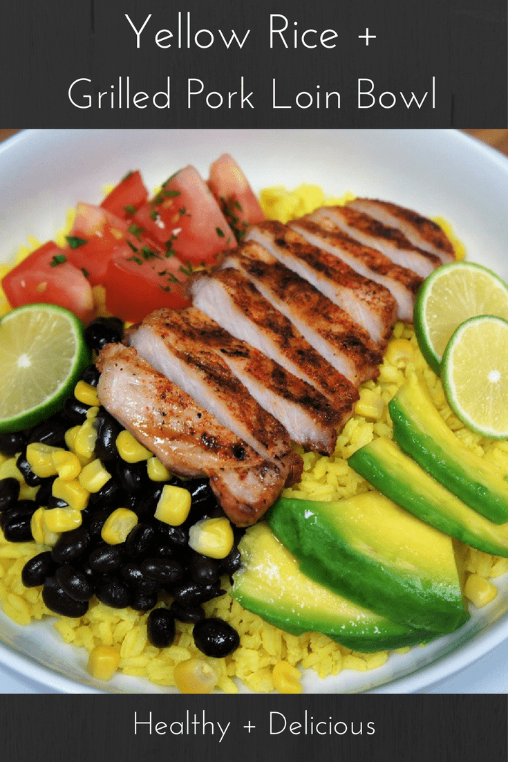 Yellow rice made with turmeric, topped with grilled pork loin chops, fresh tomatoes, avocado, corn and fresh lime juice all in one healthy, filling, delicious bowl. #porkloin #porkloinchops #yellowrice #porkricebowl #bowls #healthydinner