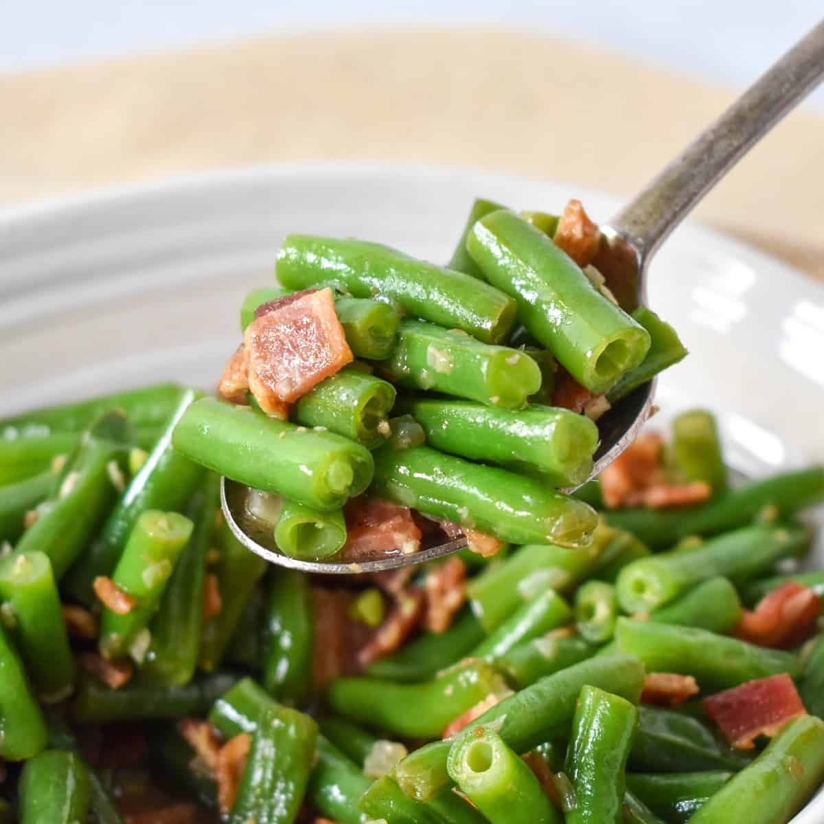 A close up of the finished side dish held up by a serving spoon.