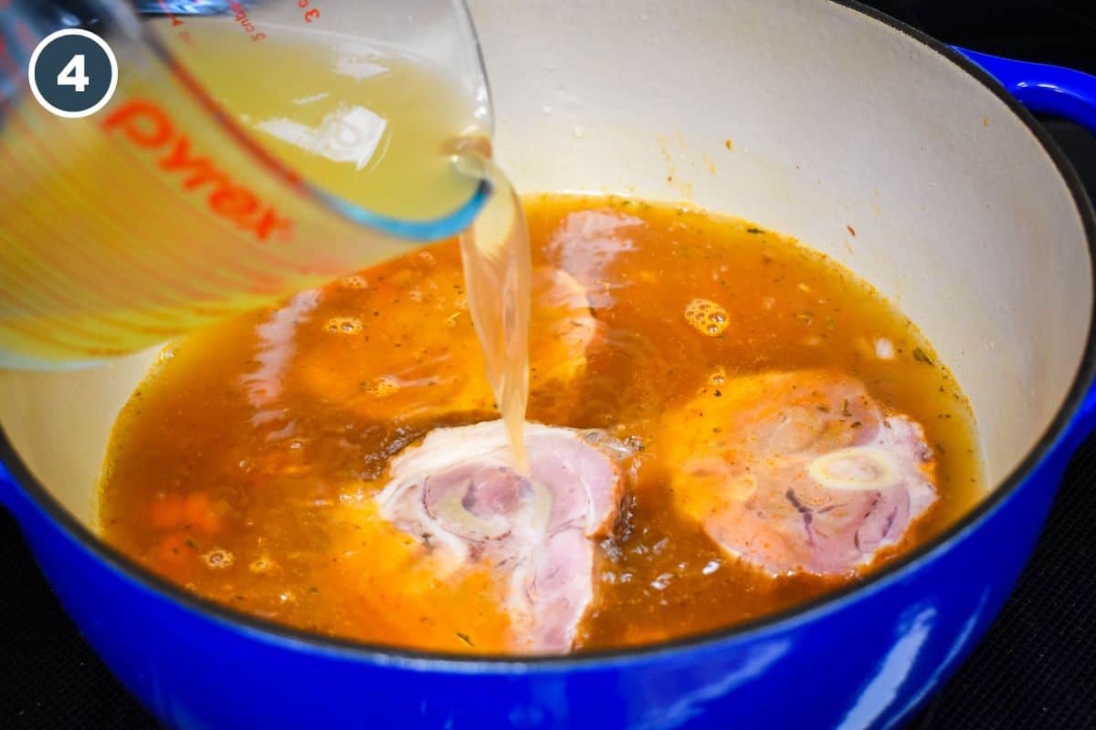 Chicken broth and water being poured into the pot.