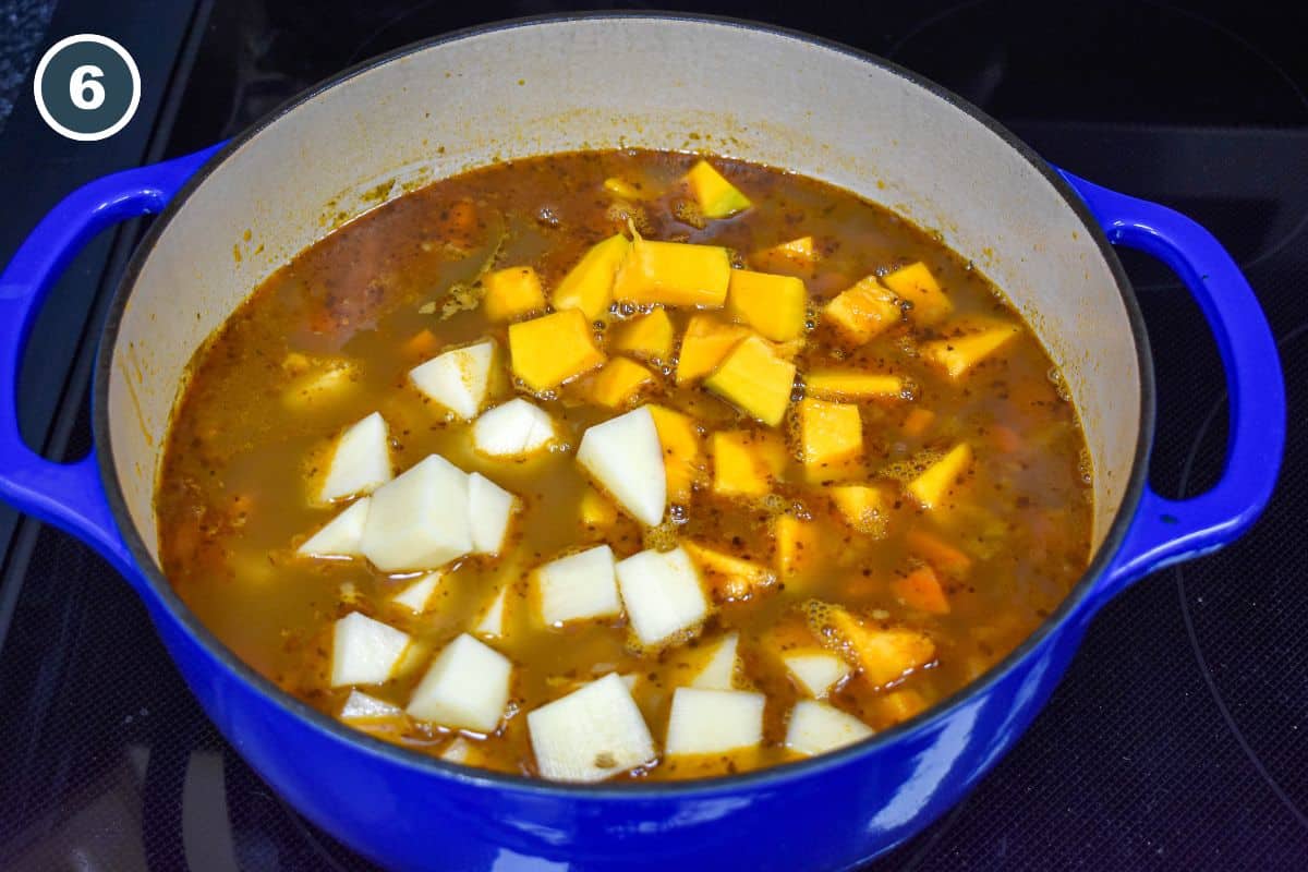 Potatoes and pumpkin added to the simmering lentil soup.