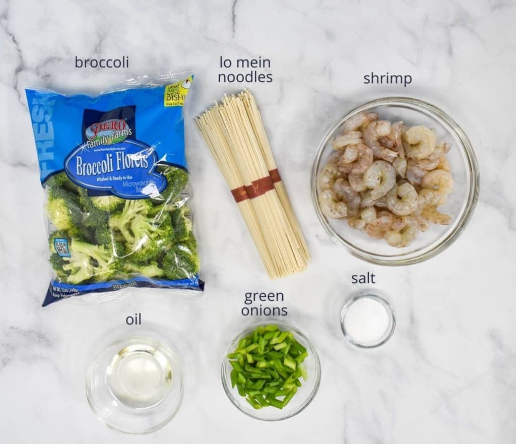 The ingredients for the lo mein without the sauce arranged on a white table.