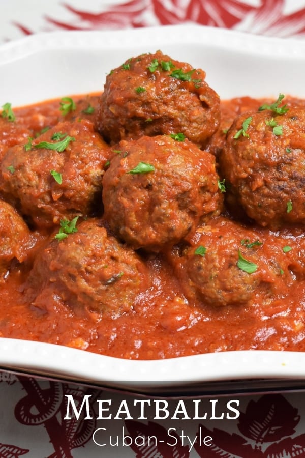 Meatballs Cuban style, this is how we had meatballs at my house, not over spaghetti but on a bed of white rice. In this recipe, the meatballs are seasoned with a combination of traditional Cuban spices – garlic powder, cumin, oregano, finely diced onions and parsley. #meatballs #Cubanfood #Cubanrecipes #groundbeef