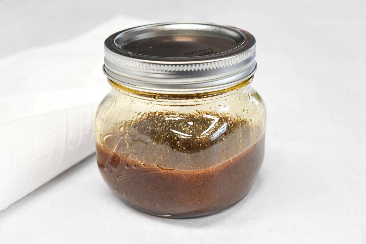 Homemade sesame dressing in a mason jar with a metal lid.