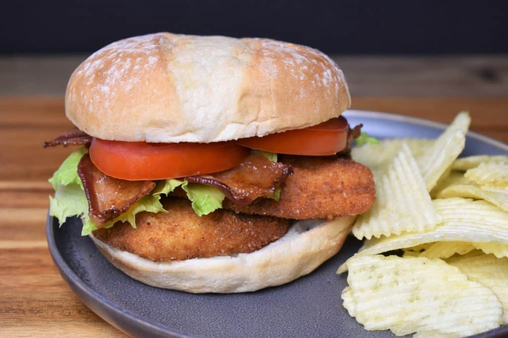 Crispy Chicken BLT, a breaded and fried chicken cutlet topped with bacon, lettuce and tomatoes served on a sandwich bun