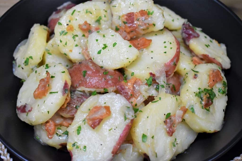 A close up of warm potato salad.