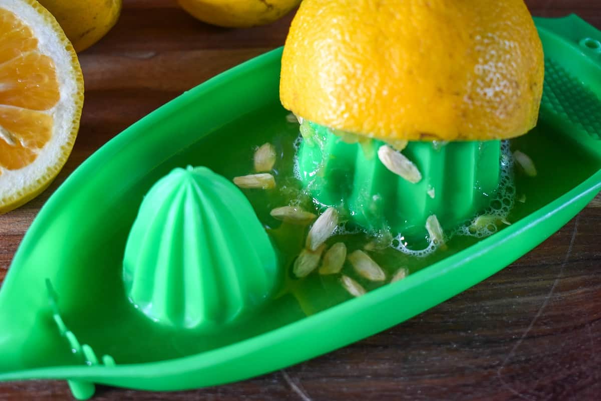 Juicing a sour orange.