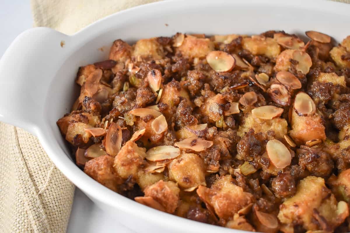 A close up of the finished stuffing in a white casserole dish