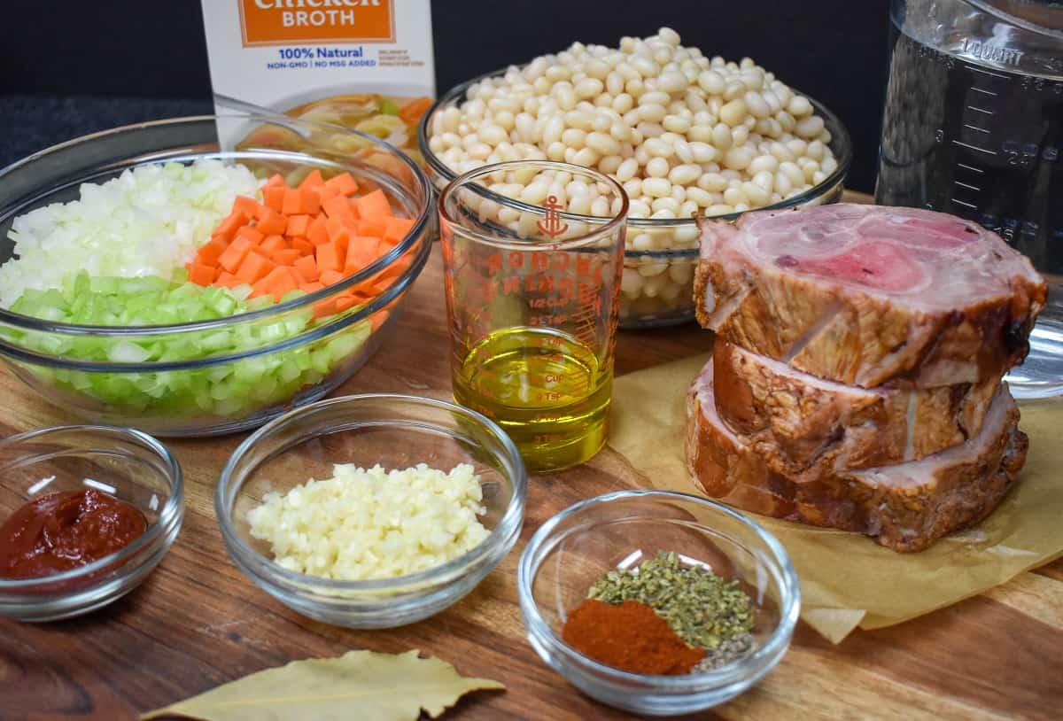 The ingredients for the navy bean soup, prepped and arranged in glass bowls.