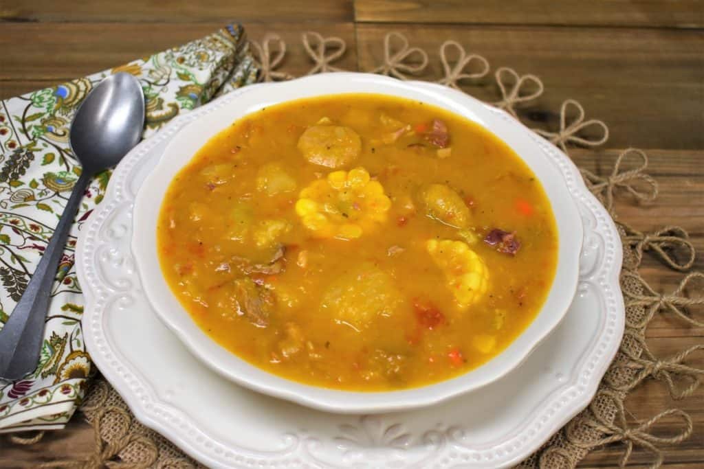 Ajiaco soup served in a large white bowl