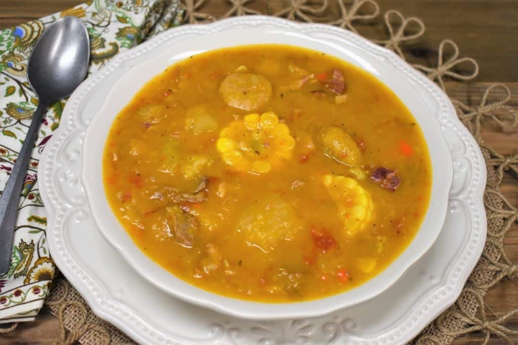 Close up of Ajiaco soup served in a white bowl