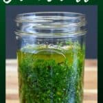 An image of the sauce in a glass canning jar with a graphic on top that reads chimichurri in white letters. The image is used for Pinterest.