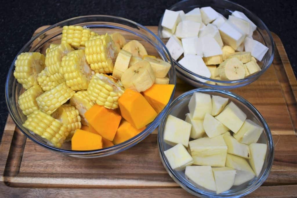 Chopped Vegetables for Ajiaco soup separated in glass bowls