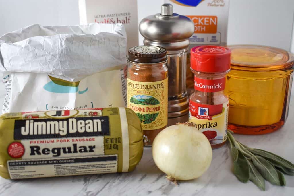 The ingredients for the sausage gravy displayed on a white table.