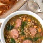 An image of the finished lentil soup with a teal graphic on top with the title in white letters.