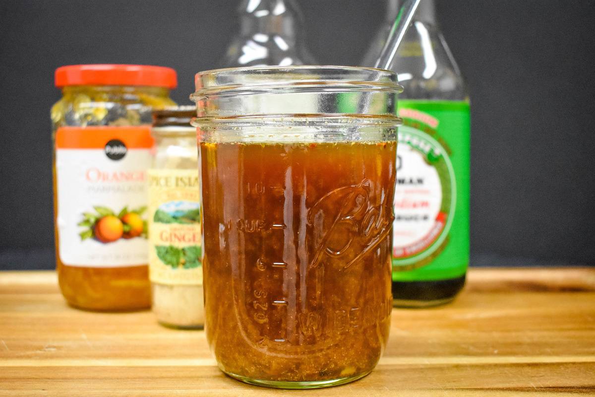 Orange sauce in a canning jar.