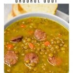 Lentil and andouille sausage soup served in a light gray bowl.