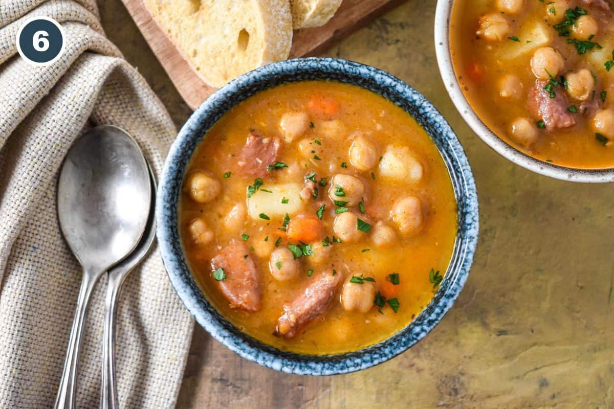 Finished soup in the pot, ready to serve with bread on the side.