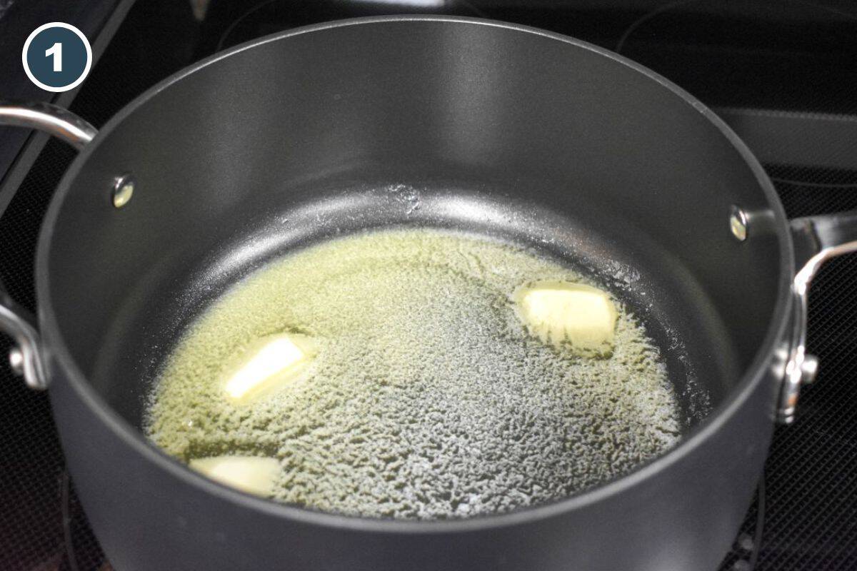 Melting butter in a saucepan over medium heat until gently simmering.