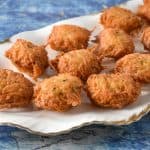 Malanga Fritters displayed on a white platter.