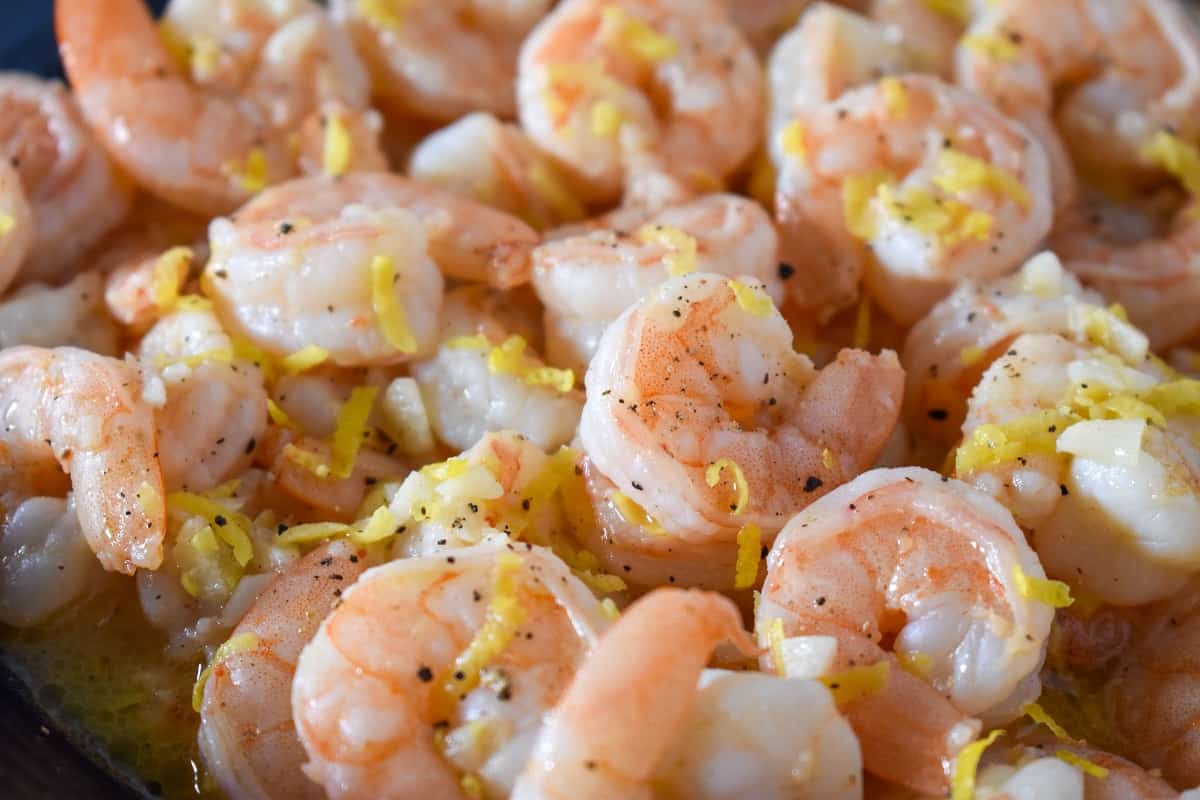 A close up image of lemon pepper shrimp.