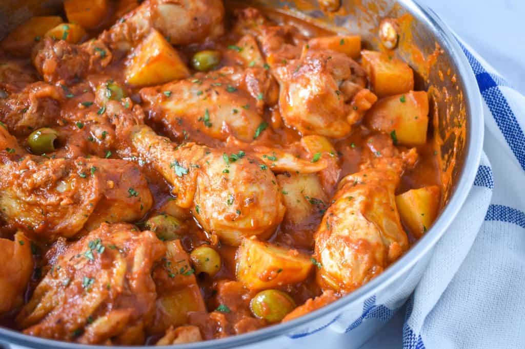 An image of the finished chicken and potatoes still in the large skillet.