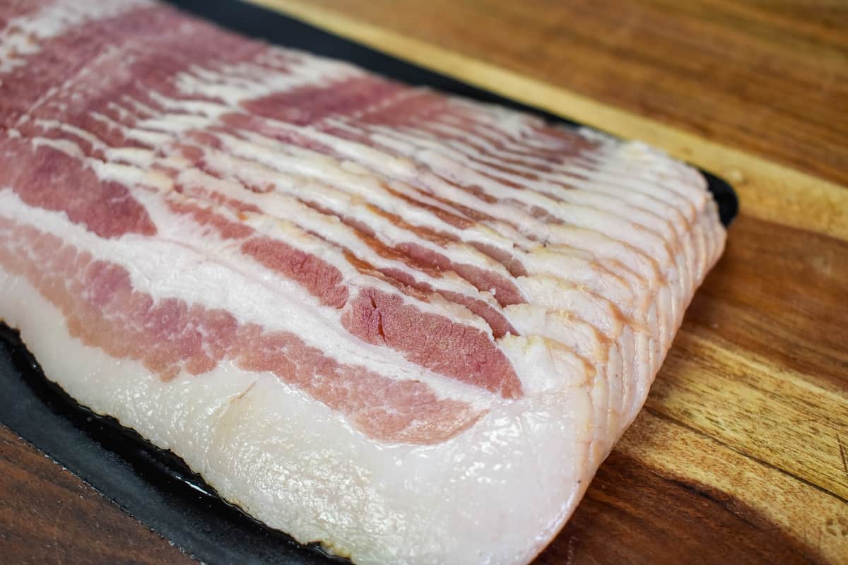 An image of uncooked bacon out of the package.