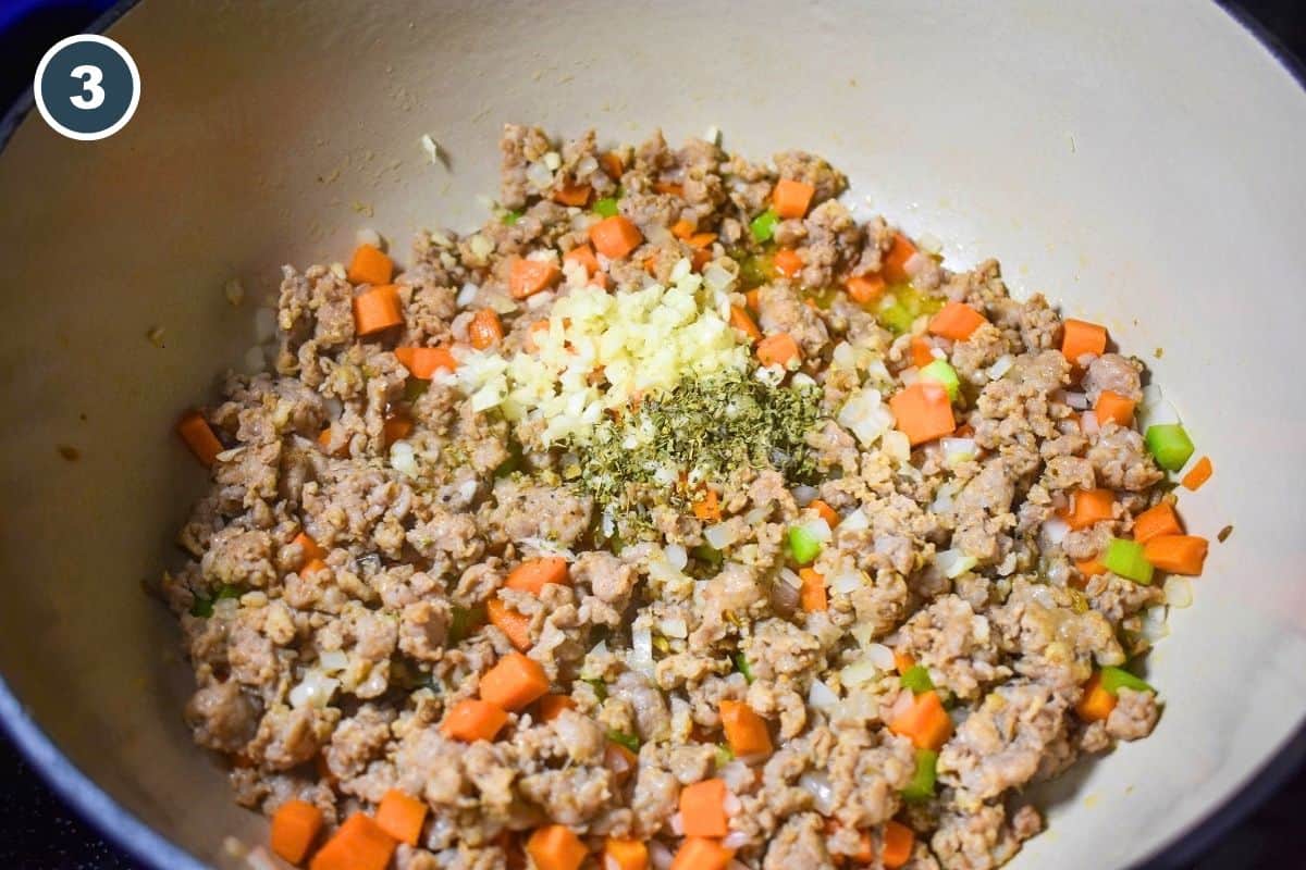 Minced garlic and Italian seasoning added to the sausage and vegetables.