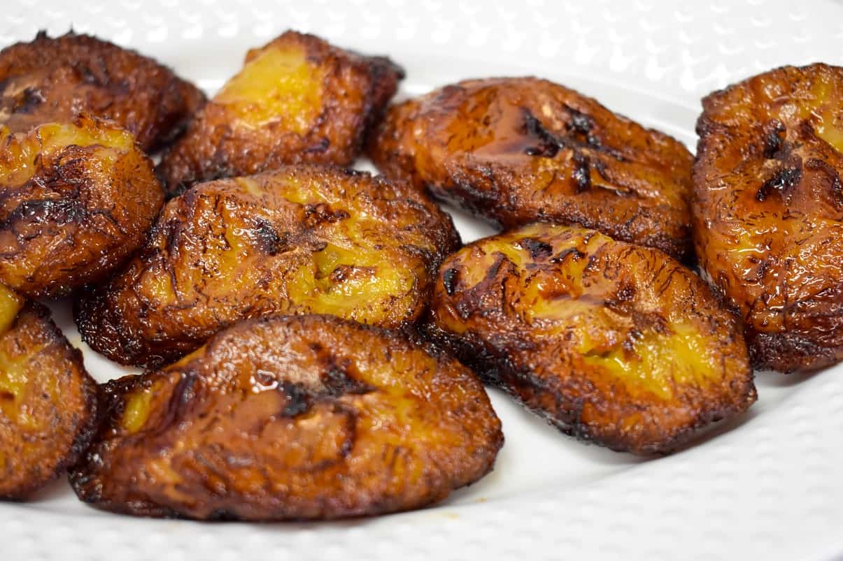 A close up of the finished side dish served on a white plate.