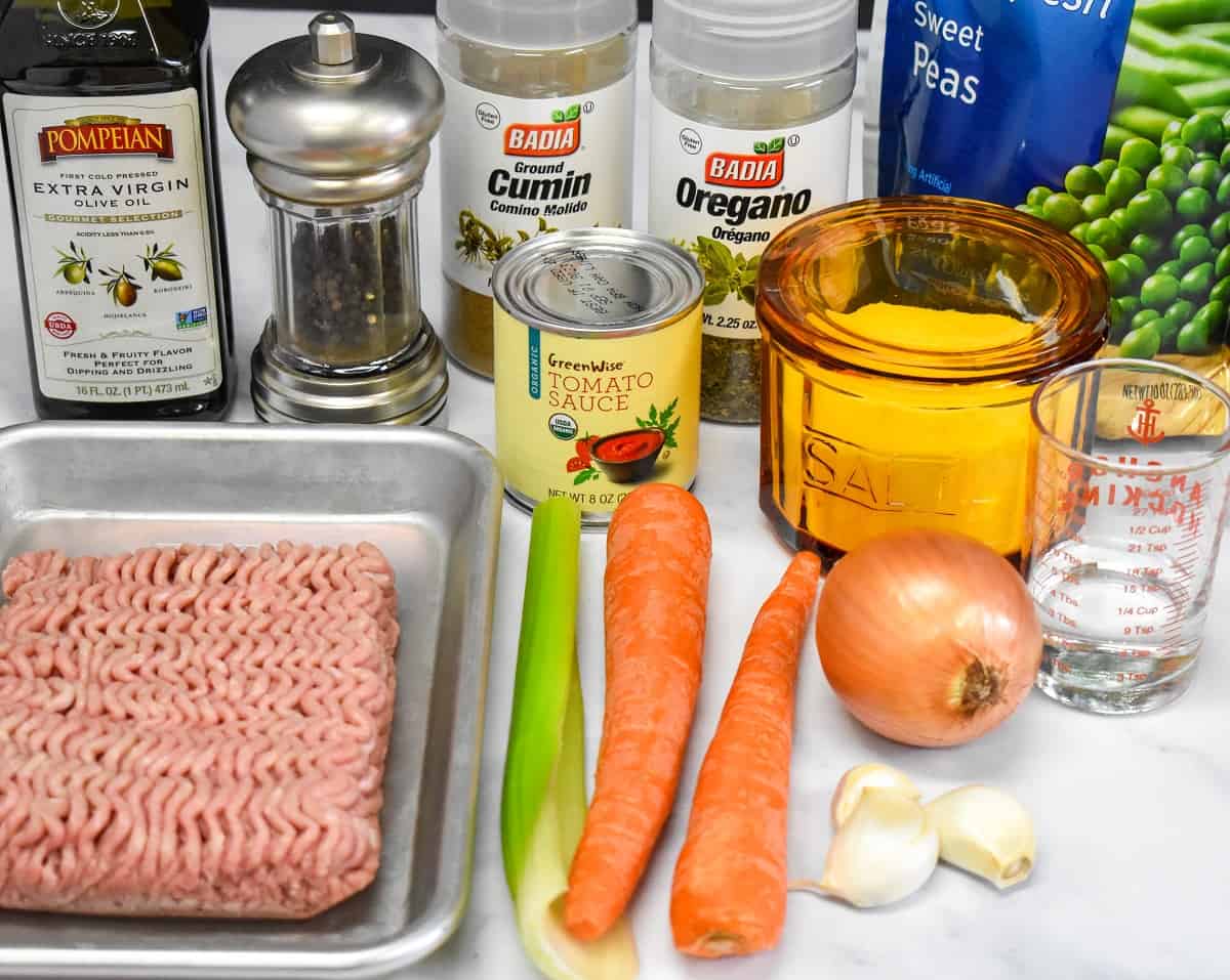 The ingredients for the turkey filling arranged on a white table.