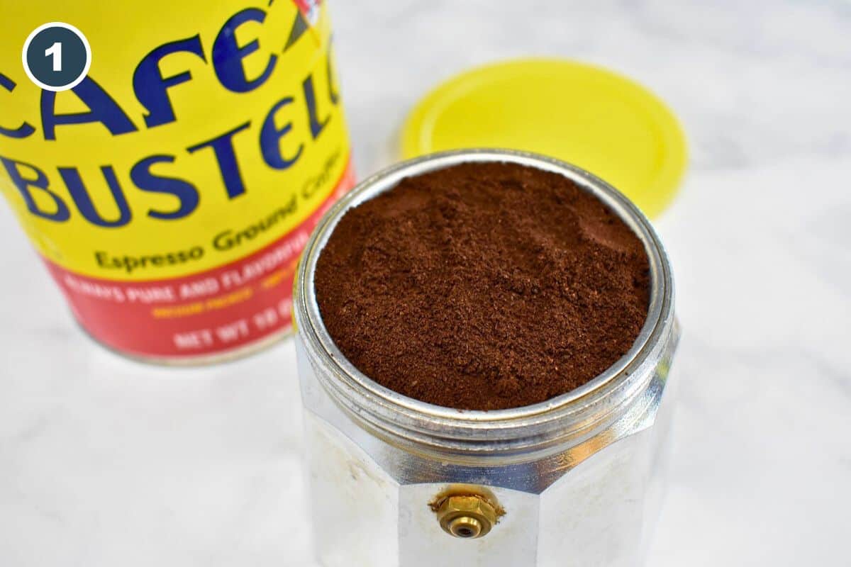 Ground Café Bustelo espresso coffee in the filter basket of a moka pot.