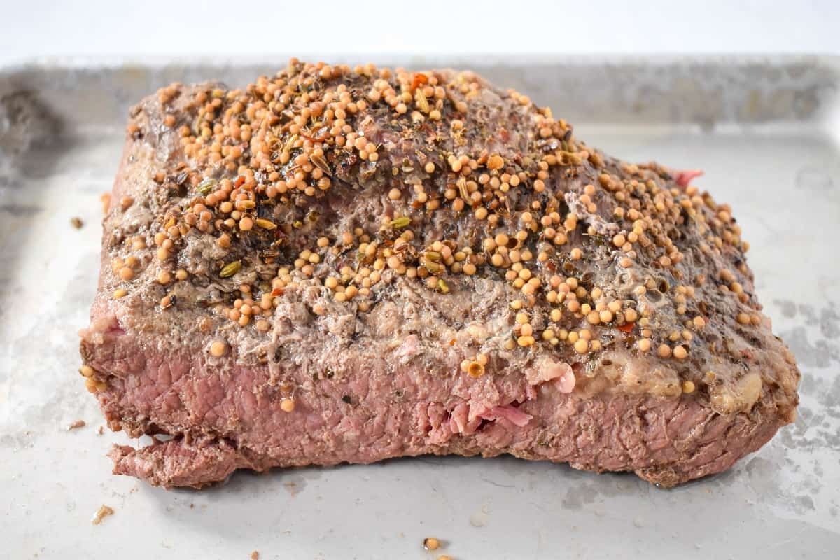The cooked beef on a sheet pan.